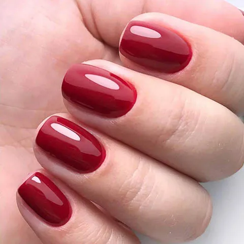 Short gel nails in deep red