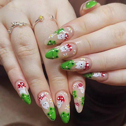 Nail design with painted toadstools and green tips