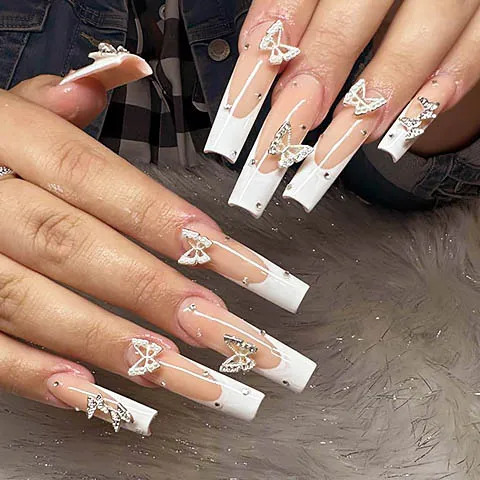 White French tips with silver butterflies