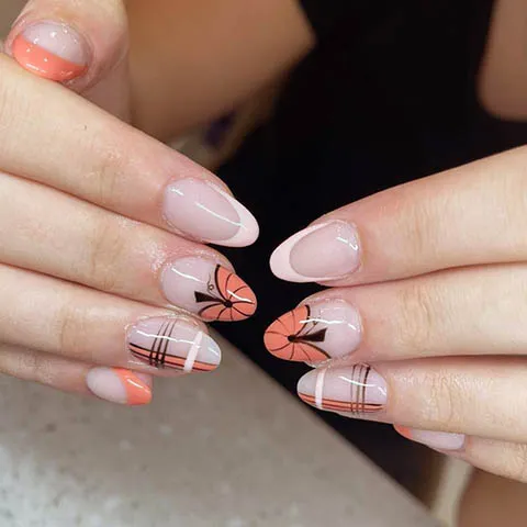 Almond nails with tartan and orange bows