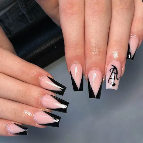 Nude nails with black V French tips and a drawn cherry