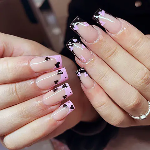 Almond nails with black and lilac heart tips