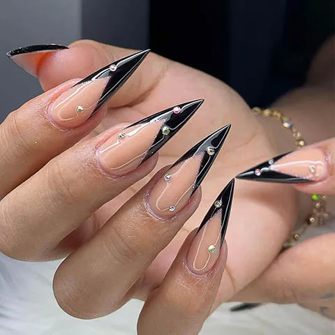 Long stiletto nails with a black V tip